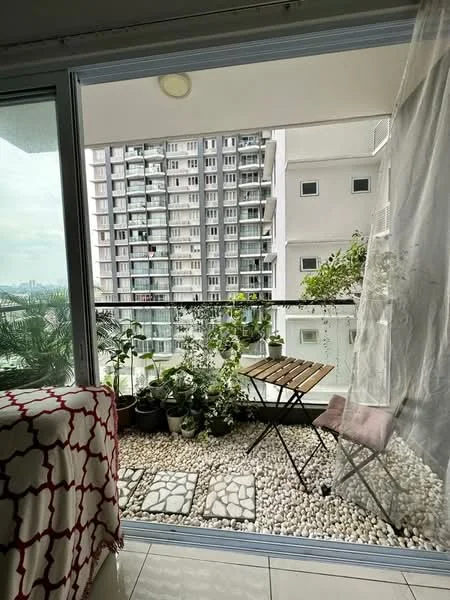 Balcony features: glass sliding door, white sheer curtains, stone-paved flooring, decorative pebbles, potted plants, folding wooden table, metal folding chair, greenery view, high-rise building view; style: modern; view: city.