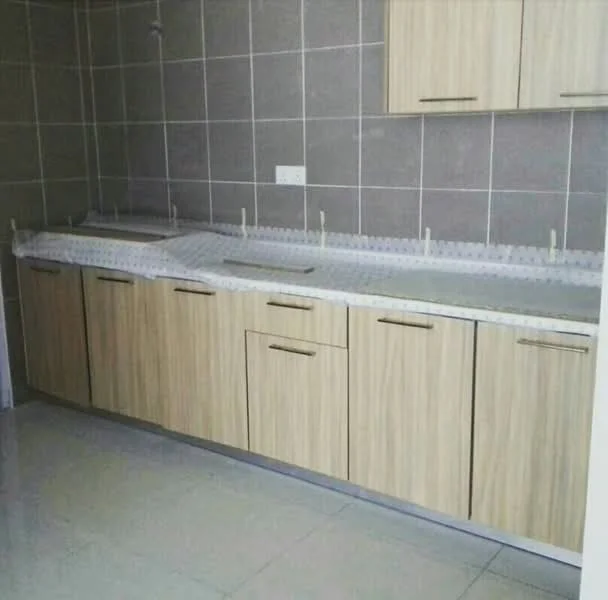 Kitchen features: laminate cabinetry in light wood finish, white countertop, ceramic tile backsplash, grey tiled walls, grey tiled flooring, under-cabinet lighting, single-bowl stainless-steel sink, chrome faucet, built-in cabinets, drawer storage; style: modern.