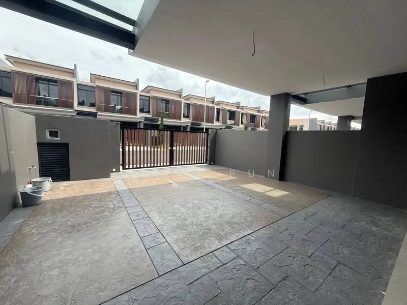 Exterior type: linked terrace house; features: paved flooring with stone texture, grey painted walls, metal gate, overhead glass roof, outdoor space, fenced perimeter, visible neighboring houses, concrete wall, outdoor water tap; style: modern.