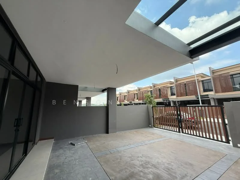 Exterior type: linked terrace house; features: flat roof, grey painted facade, glass paneling, manicured lawn, paved walkway, fence with horizontal slats, surrounded by residential units, open outdoor space; style: modern.
