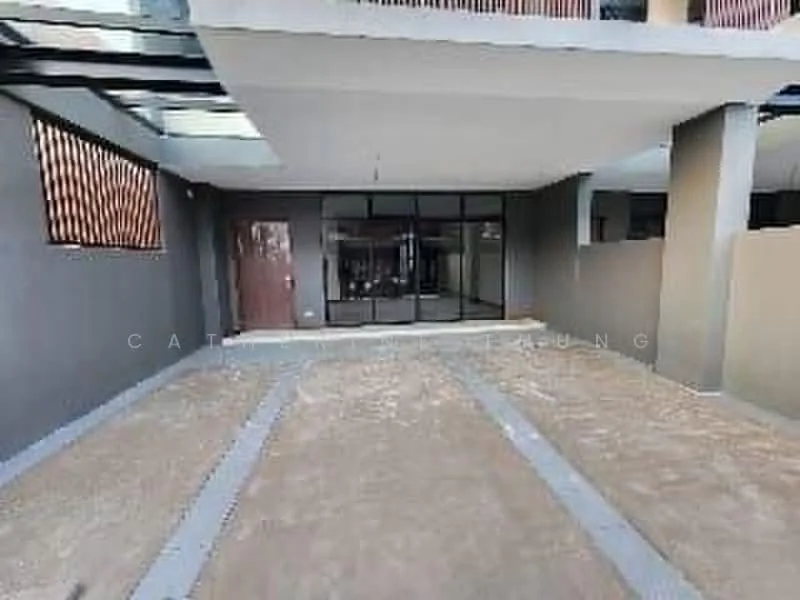Exterior features: open car porch, concrete flooring, grey painted walls, large glass windows, main entrance door, decorative wall panels, paved walkway, surrounding walls; style: modern.