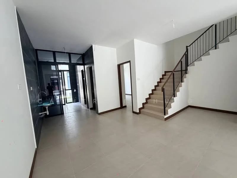 Room features: white painted walls, light grey tiled flooring, staircase with wooden handrail, large glass windows, open layout, neutral color scheme, ceiling lights, doorway leading to outdoor area; style: modern.