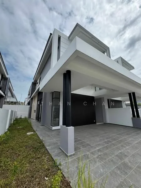 Exterior type: semi-detached house; features: white painted facade, grey accent wall, flat roof, approximately 2-storey, large windows, porch area with columns, manicured lawn, paved walkway, surrounded by fencing; style: modern.