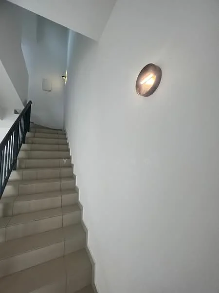 Room features: white painted walls, staircase with beige tiled steps, black railing, wall-mounted light fixture.