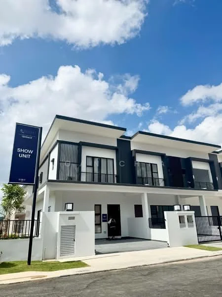 Exterior type: linked terrace house; features: white painted facade, dark grey accent panels, two-storey structure, balconies with black railings, large windows with black frames, manicured lawn, paved walkway, signboard indicating 'SHOW UNIT', gated entry, driveway, surrounded by greenery; style: modern.