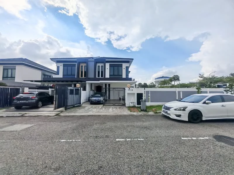 Exterior type: semi-detached house; features: two-storey building, white painted facade, blue accent trim, gated entrance, manicured lawn, paved driveway, two cars parked in driveway, front porch with light fixtures, surrounded by low wall, landscaped garden area, clear sky, urban setting; style: modern.