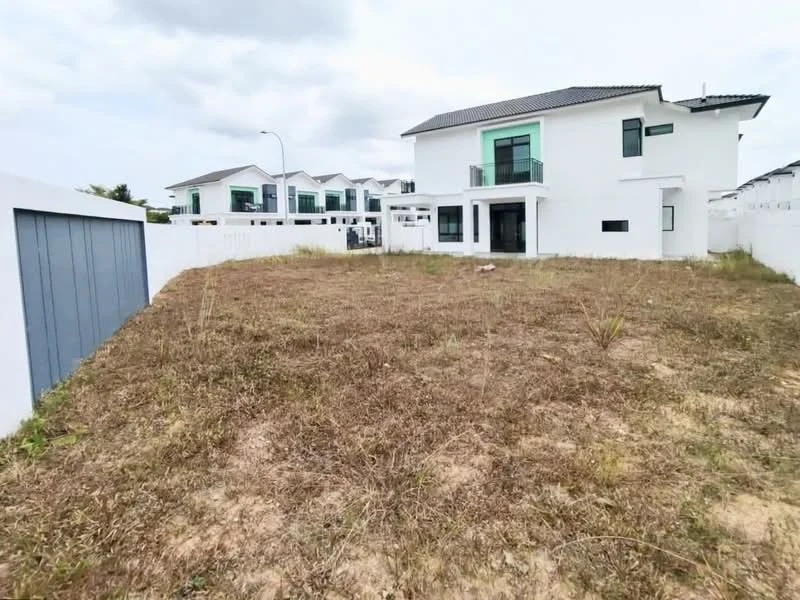 Exterior type: detached bungalow; features: white painted facade, green accent windows, flat roof, manicured lawn area, surrounded by fencing, driveway with interlocking pavers, two-storey structure, landscaped garden area, adjacent to other residential units; style: modern.
