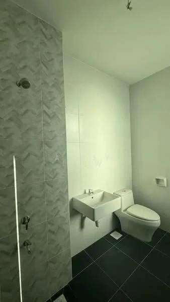 Bathroom features: walk-in shower with glass enclosure, chrome rain shower head, chrome handheld shower, white wall-mounted sink, one-piece toilet, grey tile wall with textured pattern, white tiled walls, black floor tiles; style: modern.