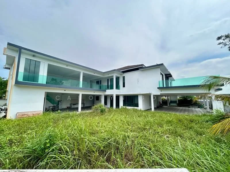 Exterior type: detached bungalow; features: white painted facade, glass balcony railings, flat roof, approximately 2-storey, manicured lawn, surrounded by greenery, large windows, car porch with awning, outdoor terrace, open space around the building; style: modern.