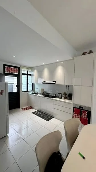 Kitchen features: white cabinetry, black countertop, stainless-steel sink, chrome pull-down faucet, built-in oven, freestanding fridge, ceramic tile flooring, recessed downlights, window with black frame, kitchen island with seating, decorative towels, white walls; style: modern.