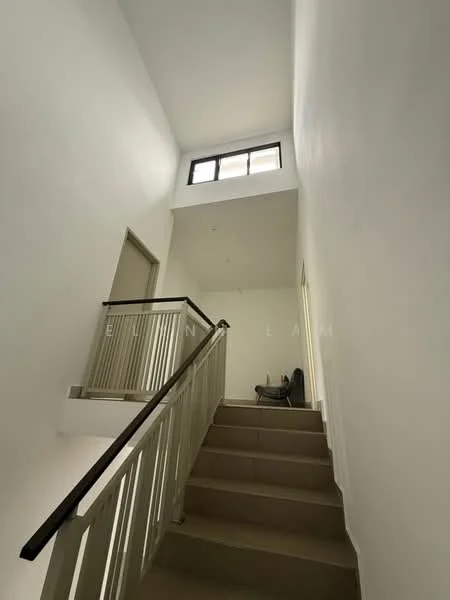 Room features: white painted walls, staircase with wooden handrail, carpeted stairs, window at the top of the staircase, natural light from window, neutral color scheme, doorway leading to another room, open space at the top of the stairs; style: modern.