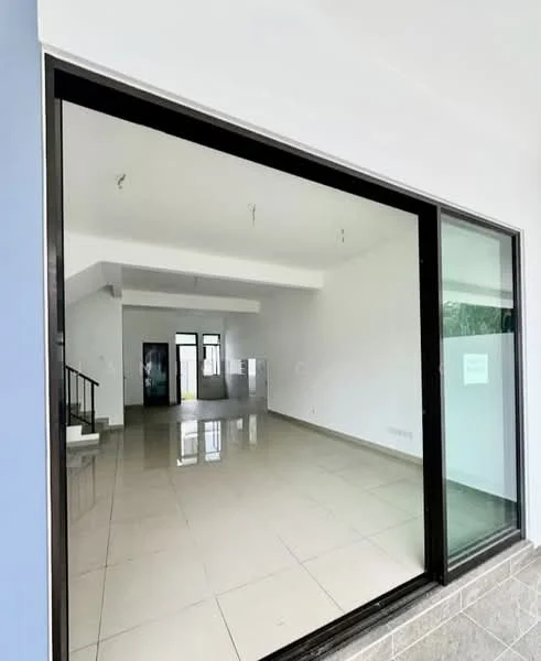 Room features: large glass sliding door, white painted walls, tile flooring, ceiling with recessed lighting, open layout, no visible furniture, natural light from large windows, staircase visible in background; style: modern.