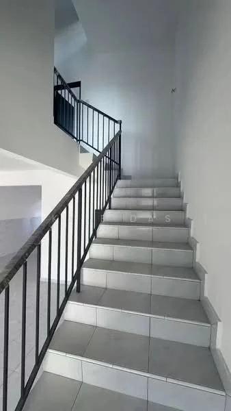 Room features: staircase with metal railing, white painted walls, grey tiled flooring, natural light from upper level, open space at the bottom of the stairs; style: modern.