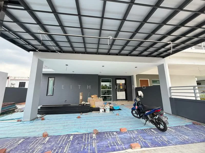 Exterior features: flat roof with metal framing, grey painted facade, large front entrance, concrete flooring, landscaping with stones, motorcycle parked in front, construction materials visible, blue tarpaulin on ground; style: modern.