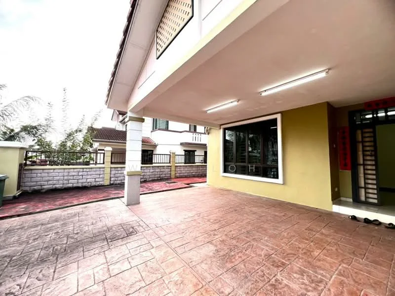 Exterior type: detached bungalow; features: covered porch area, stamped concrete flooring, exterior wall painted in light green, large windows, security grille at windows, manicured garden area, brick boundary wall, driveway with interlocking pavers; style: modern.