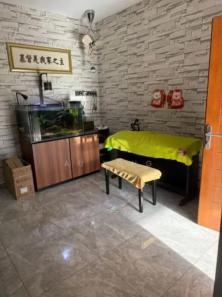 Room features: stone feature wall, grey tiled flooring, wooden cabinet with fish tank, green tablecloth on table, wooden bench, decorative wall art, natural light from window, cardboard boxes; style: modern.