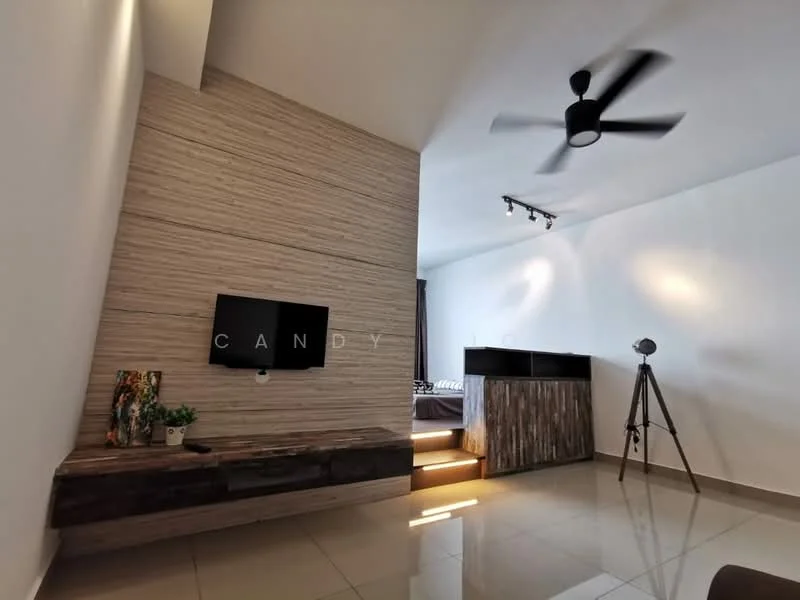 Living features: wood accent wall, flat-screen TV mounted on wall, dark wood TV console, light-colored tiled flooring, ceiling fan, track lighting, decorative tripod floor lamp, decorative plant in ceramic pot, wooden storage unit, step-up area leading to bedroom; style: modern.