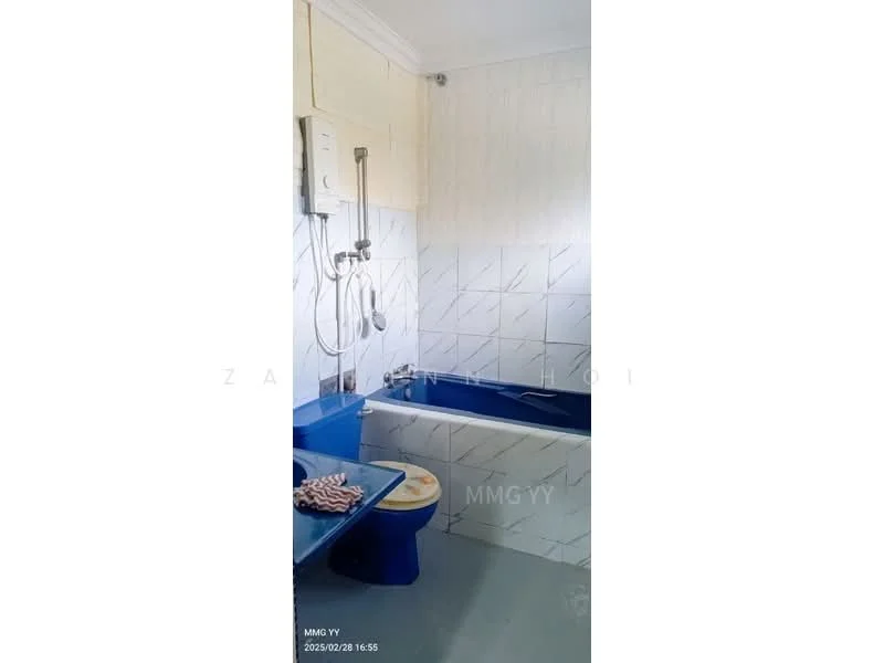 Bathroom features: bathtub, shower head, wall-mounted faucet, blue ceramic tiles, white tiled walls, white ceiling, grey flooring, toilet, water heater, sink, mirror.