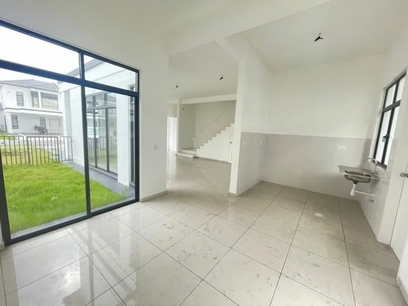 Room features: large floor-to-ceiling windows, white painted walls, grey tiled flooring, open layout, stainless-steel sink, natural light from windows, high ceiling, staircase visible in background; style: modern; view: garden.