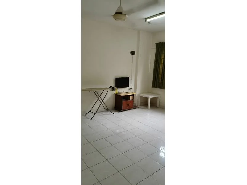 Room features: white painted walls, white tile flooring, ceiling light, window with green curtains, folding table, TV stand, small white table.