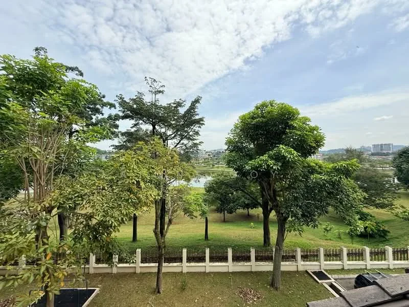 Exterior features: lush greenery, mature trees, open lawn area, fenced perimeter, water body in the background, clear blue sky, urban skyline visible in distance.