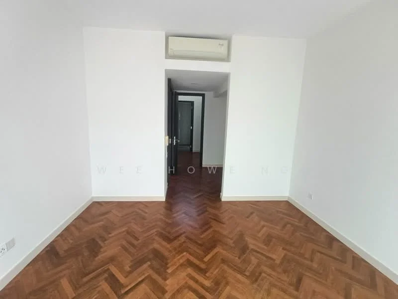 Room features: white painted walls, herringbone wood flooring, 1 wall-mounted split AC, doorway leading to another room, neutral color scheme, no visible furniture or decor; style: modern.