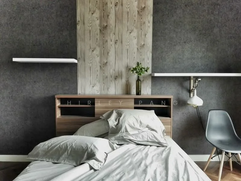 Bedroom features: grey accent wall, wood paneling behind headboard, queen-size bed with grey bedding, floating shelves on either side of the bed, table lamp with white shade, modern chair, wooden flooring; style: modern.