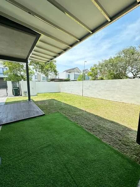 Exterior features: manicured lawn, artificial grass, concrete wall, patio area with wooden decking, clear blue sky, surrounded by residential buildings; style: modern.