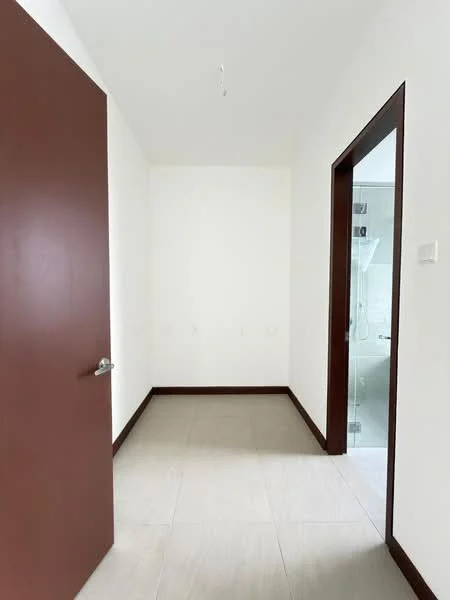 Room features: white painted walls, light grey tile flooring, brown wooden door, brown door frame, ceiling light fixture, no visible windows, neutral color scheme; style: modern.
