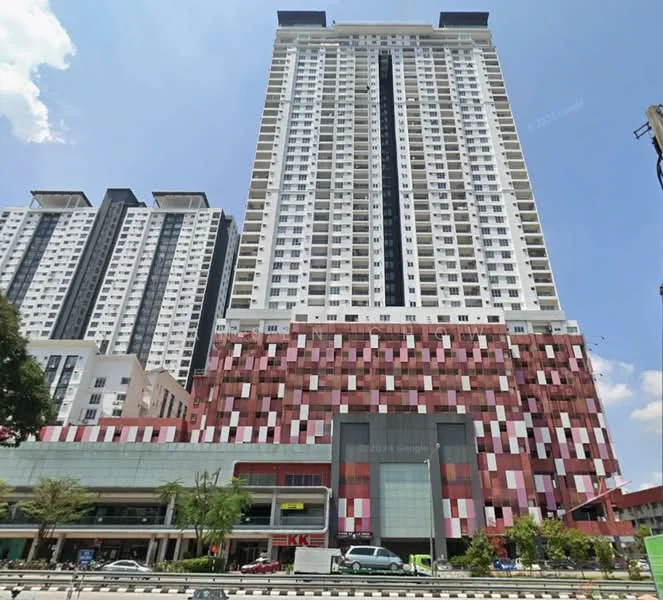 Exterior type: high-rise condominium; features: glass curtain wall, red and white patterned facade, multiple balconies, approximately 30-storey high-rise, commercial space at ground level, surrounded by urban landscape, parking area visible, main entrance with awning; style: modern.