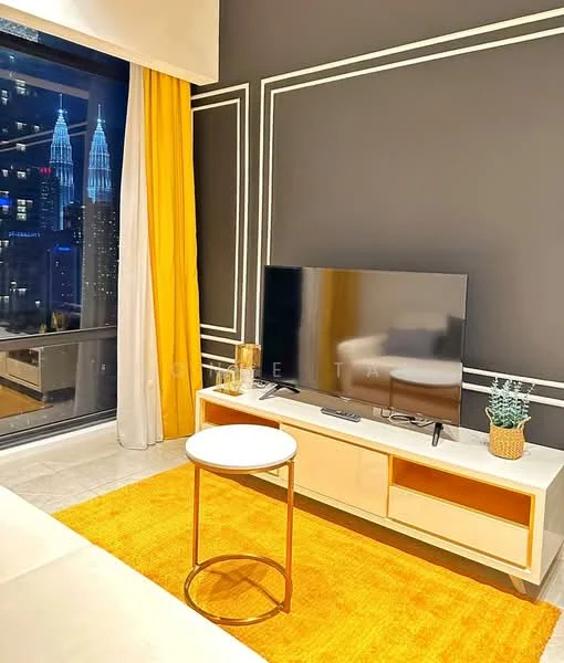 Living features: floor-to-ceiling windows, black accent wall with white trim, light grey flooring, yellow curtains, white TV console, flat-screen TV, round bar stool, orange area rug, decorative plant in pot, city skyline view; style: modern; view: city.