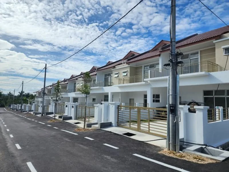 Exterior type: linked terrace house; features: two-storey linked terrace houses, cream painted facade, red pitched tile roof, balconies on upper floor, manicured lawn in front, concrete driveway, street lighting, surrounded by greenery, newly constructed, sidewalk along the road; style: modern.
