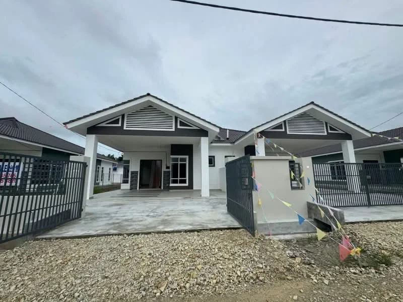 Exterior type: detached bungalow; features: white painted facade, pitched tile roof, front porch with columns, manicured gravel landscaping, fenced perimeter, double-volume main entrance, visible driveway, decorative bunting, grey stone pathway, gated entry; style: modern.