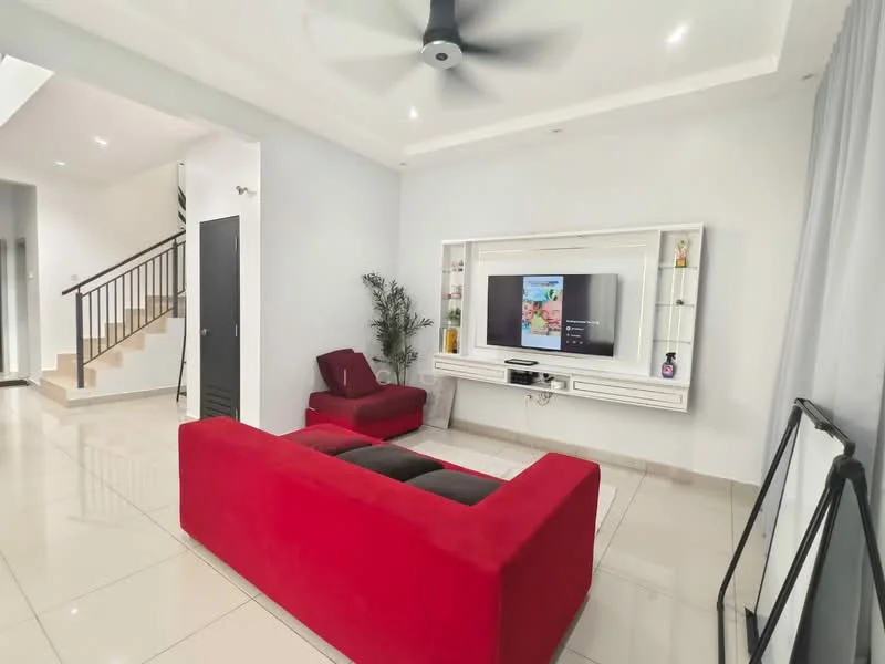 Living features: red fabric sofa, black leather sofa, wall-mounted TV, white entertainment unit, recessed downlights, ceiling fan, glossy tile flooring, decorative plant, large window with sheer curtains, open layout to staircase, neutral painted walls; style: modern.
