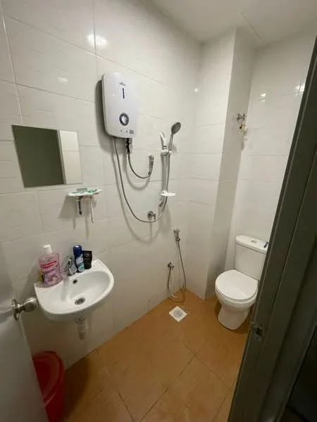 Bathroom features: white tiled walls, brown ceramic tile flooring, single-sink vanity with wall-mounted faucet, mirror above sink, one-piece toilet, shower with handheld showerhead, water heater mounted on wall, soap dish mounted on wall; style: modern.