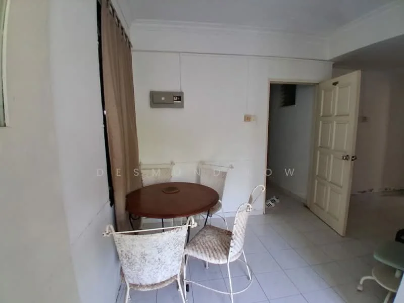Room features: white painted walls, white ceiling, tile flooring, round dining table, 2 metal chairs with cushions, wall-mounted air conditioning unit, doorway leading to another room, window with curtain, light switch, power outlet; style: minimalist.