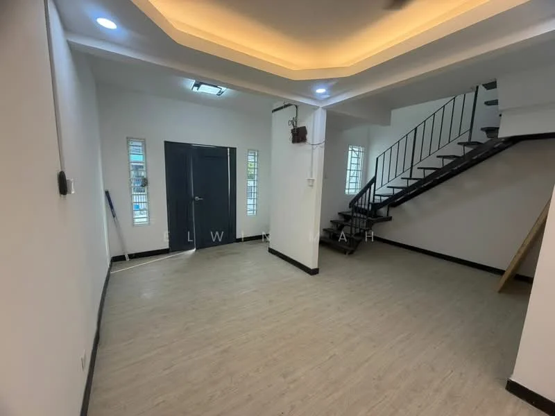 Room features: light wood laminate flooring, white painted walls, recessed ceiling lights, staircase with black metal railing, two narrow windows, main entrance door, open layout, ceiling with cove lighting; style: modern.