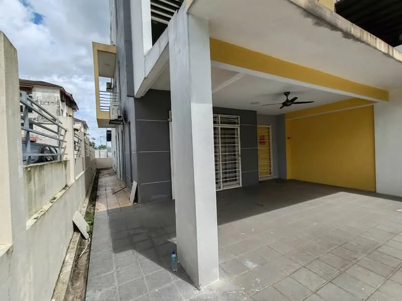 Exterior type: linked terrace house; features: grey painted facade, yellow accent wall, flat roof, covered porch area, sliding glass door, floor-to-ceiling windows, ceiling fan, paved flooring, side walkway, fenced boundary; style: modern.