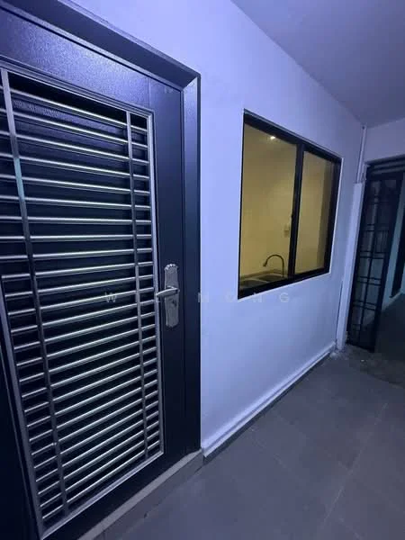 Room features: metal security door with vertical slats, white painted walls, large window with black frame, grey tiled flooring, visible plumbing fixtures, interior lighting, corner of another room visible; style: modern.