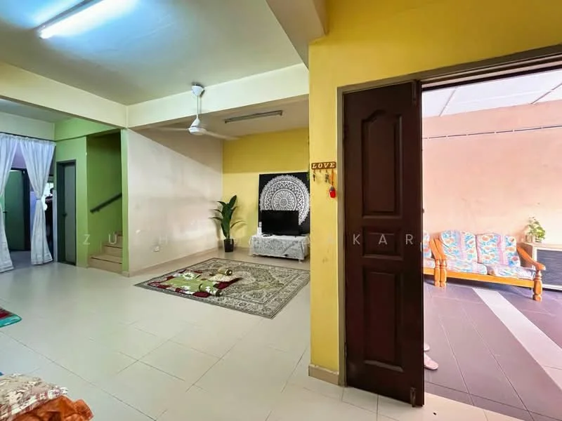 Living features: yellow painted walls, white ceiling, 5-blade ceiling fan, tile flooring, area rug, sofa with cushions, decorative wall art, potted plant; style: modern; view: garden. Balcony features: outdoor seating, tile flooring, covered area, decorative cushions; style: modern; view: garden.