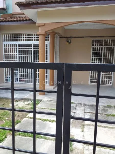 Exterior type: linked terrace house; features: black metal gate, concrete pathway, gravel surface, white window grilles, cream painted facade, terracotta roof tiles, porch area, exposed columns, outdoor lighting, manicured lawn; style: modern.