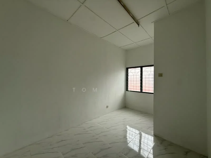 Room features: white painted walls, marble tile flooring, ceiling with grid tiles, single window with grille, natural light from window.