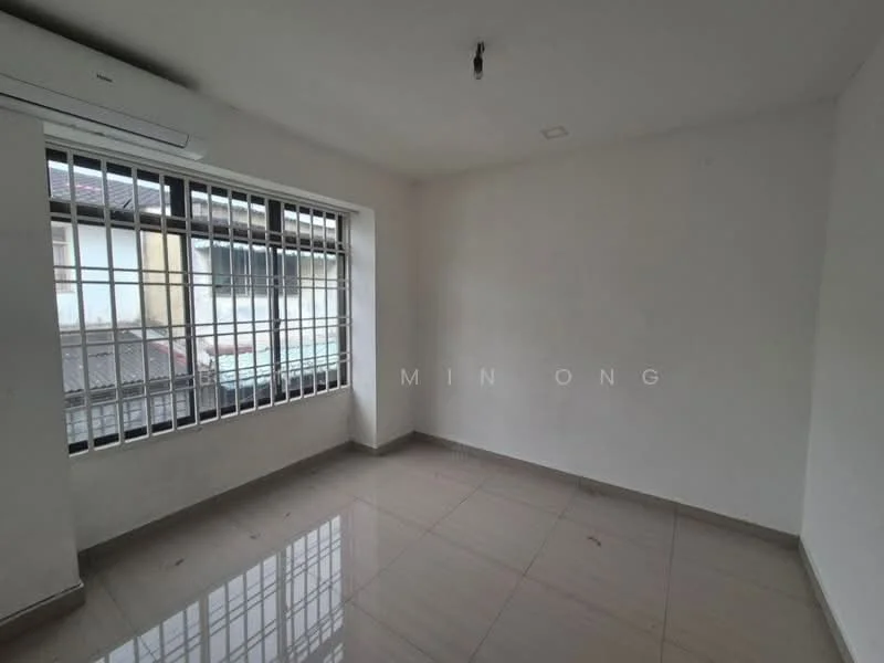 Room features: white painted walls, tile flooring, large window with security bars, air conditioning unit, neutral ceiling, no visible furniture, natural light from window; style: minimalist.