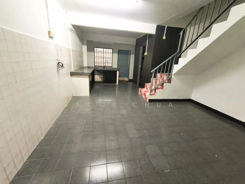 Room features: black tile flooring, white tiled walls, staircase with metal railing, open layout, window with grid pattern, kitchen counter, light fixtures on ceiling, no visible appliances.