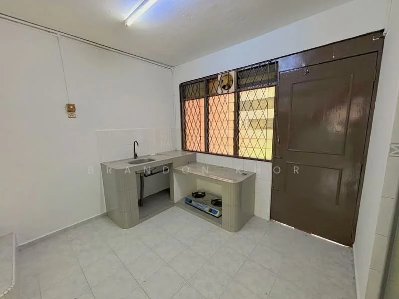 Kitchen features: single-bowl stainless-steel sink, chrome pull-down faucet, grey laminate countertop, white tiled backsplash, white walls, light grey floor tiles, window with metal grille, built-in cabinetry, open shelving, wall-mounted electrical outlet.