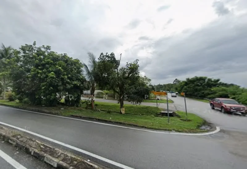 Exterior features: curved road, green landscaping, mature trees, paved road, road signage, residential area, cloudy sky.