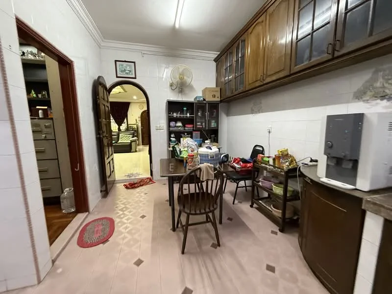 Kitchen features: wooden cabinetry with glass doors, granite countertop, stainless-steel water dispenser, dining table with wooden chairs, tile flooring in light pink, wall-mounted fan, open archway leading to living area, various kitchen appliances and food items on countertop, built-in shelving unit, white tiled walls; style: traditional.