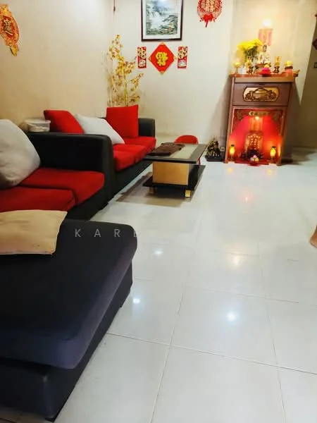 Living features: 3-seater fabric sofa in red and black, 2-seater fabric sofa in black, coffee table with gold accents, white tiled flooring, decorative wall art, wall-mounted decorations, small altar with candles and ornaments, yellow floral decorations, ambient lighting, red and gold wall decorations; style: contemporary.