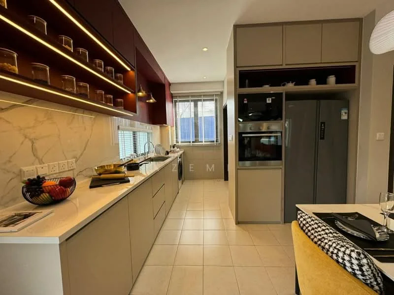 Kitchen features: white marble countertop, grey cabinetry, red accent wall with lighting, stainless-steel fridge, built-in oven, ceramic tile flooring, window with blinds, kitchen island, glass jars on shelves, decorative fruit bowl; style: modern.