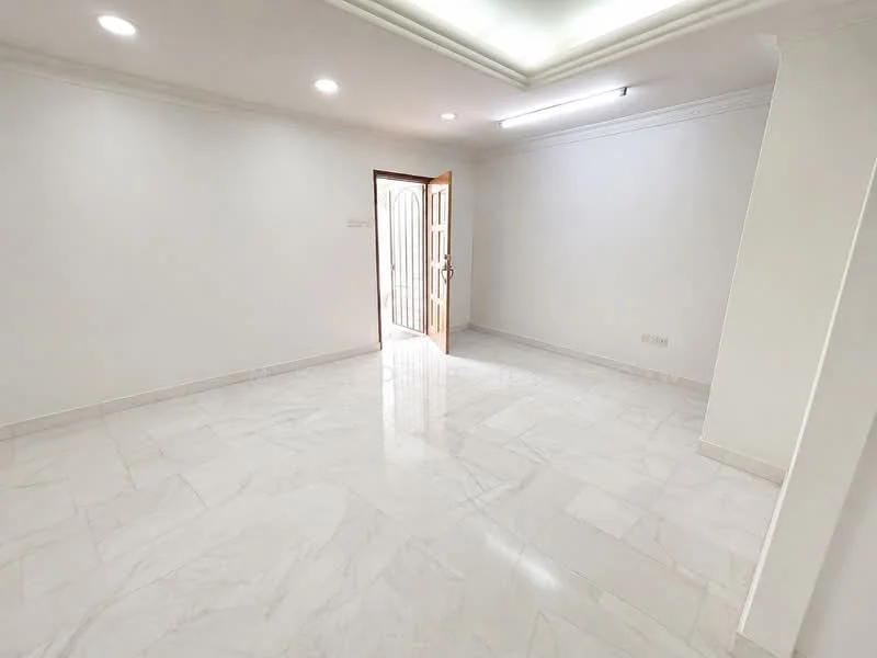 Room features: white painted walls, marble tile flooring, recessed downlights, double-door entry, crown moulding, natural light from door, neutral color scheme; style: modern.